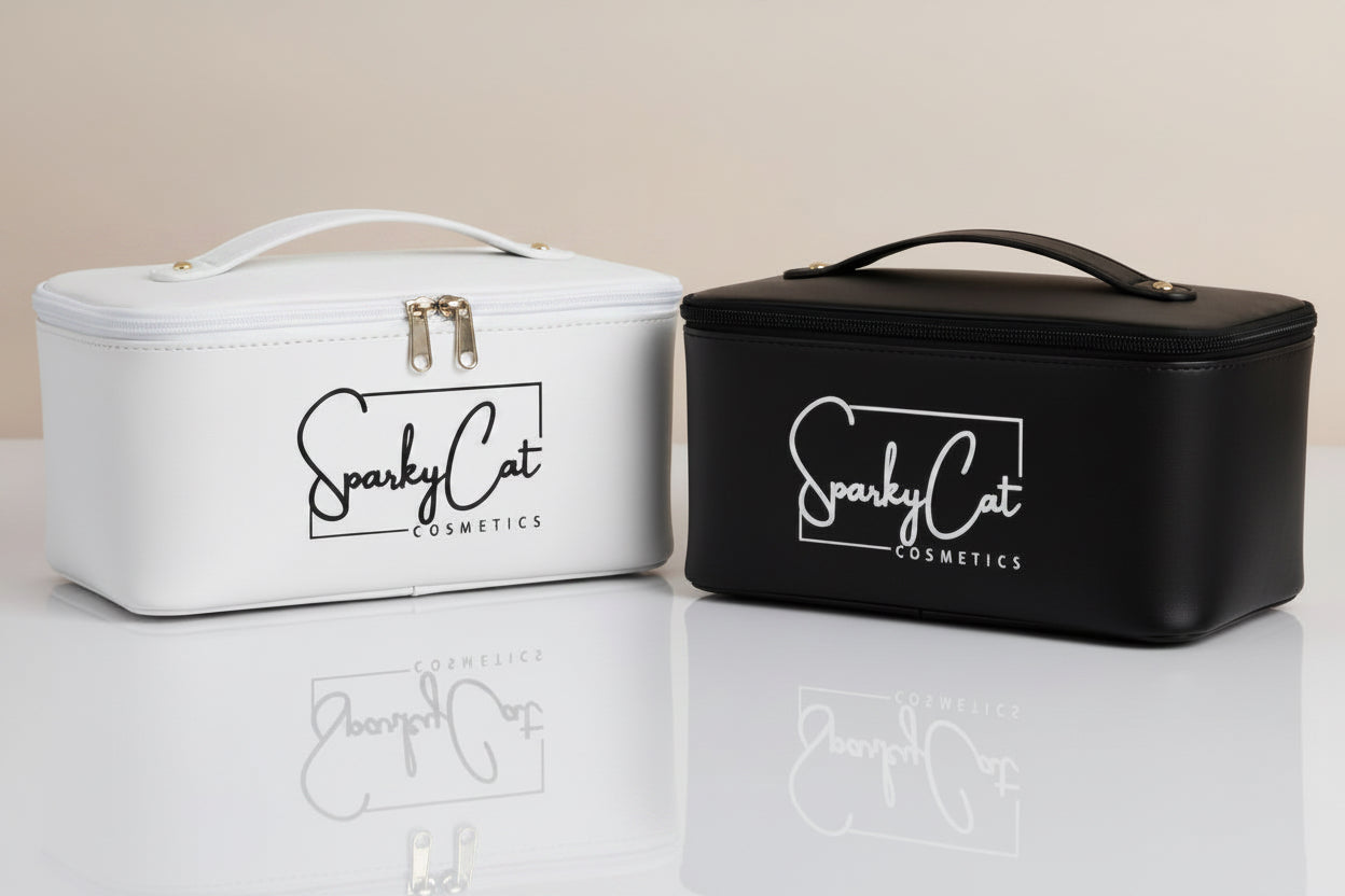 Two different color  rectangular cosmetic cases on a reflective white surface against a warm beige background. The left case is white with black trim and a white handle, and the right case is black with a black handle.